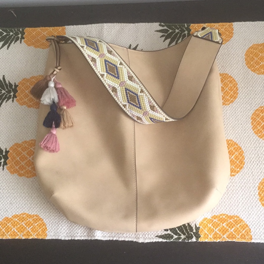 Tan colored tote bag with tribal strap